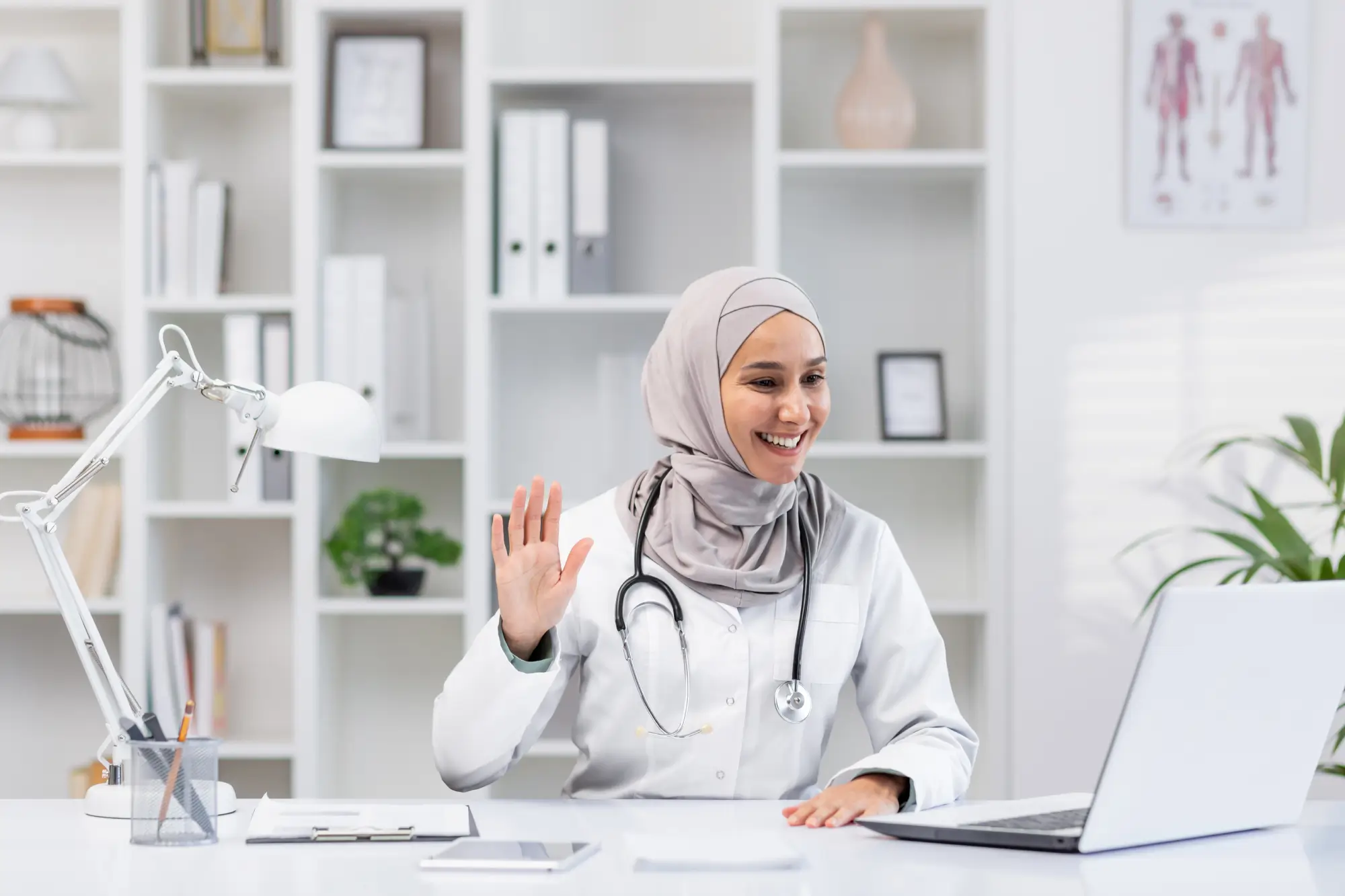 friendly-muslim-female-doctor-greeting-during-a-vi-2024-05-07-17-26-15-utc-1.webp