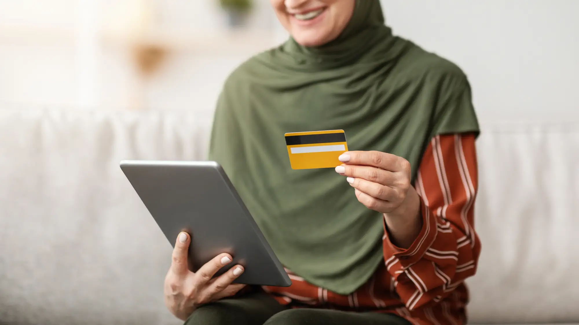 unrecognizable-muslim-woman-using-digital-tablet-a-2024-12-23-22-30-11-utc-1.webp